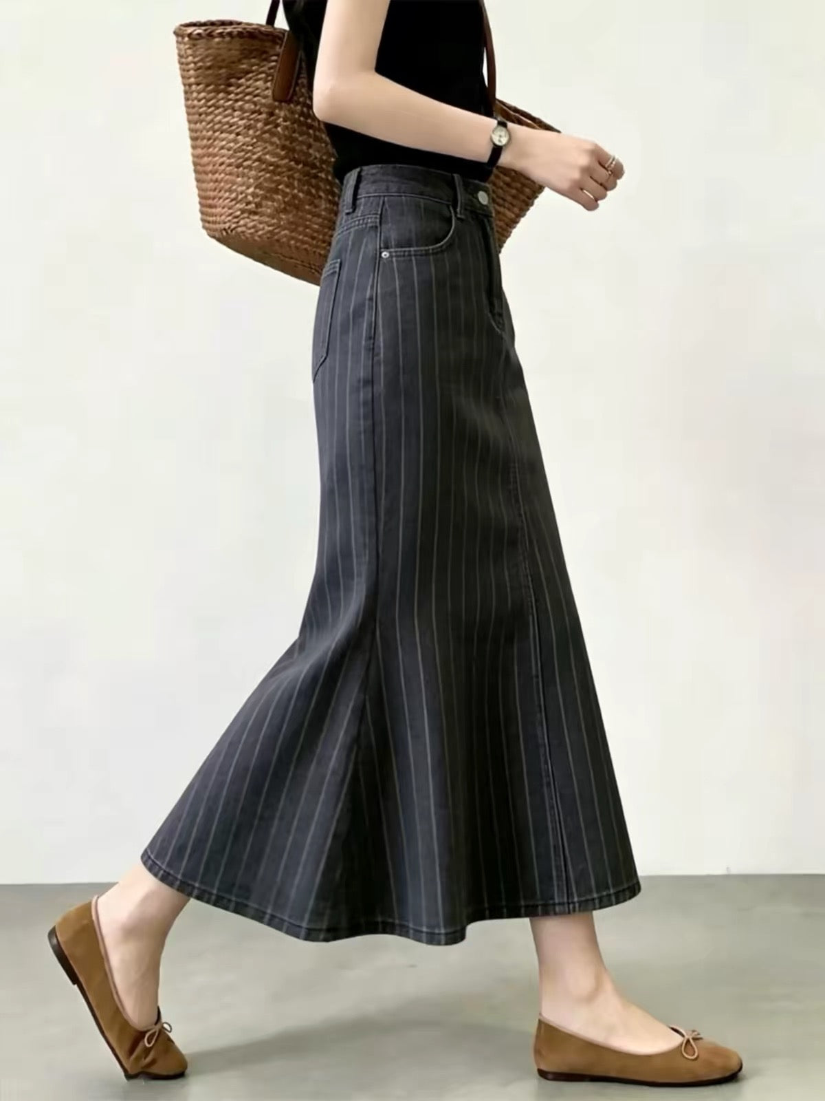 Women’s A-line midi skirt in a dark gray striped pattern—a versatile, high-waisted, and flattering choice for workwear, perfect for the new autumn season.