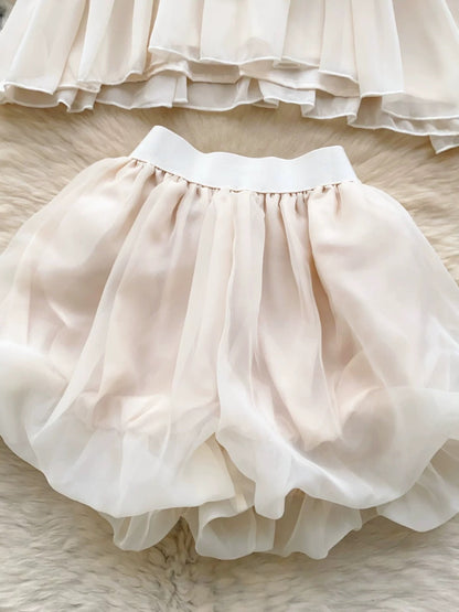 Rich Heiress Style Suit: Pure and alluring beaded halter neck sleeveless chiffon top with ruffles + high-waisted tulip shorts