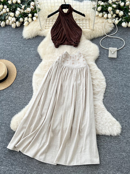 French-style sexy halter neck sleeveless top, high-waisted, heavily embellished with rhinestones, and flowing skirt set.