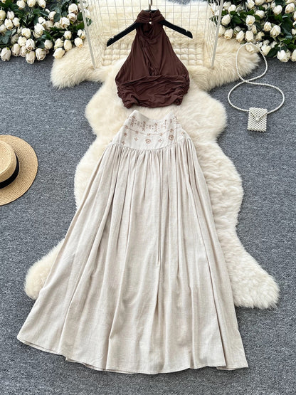 French-style sexy halter neck sleeveless top, high-waisted, heavily embellished with rhinestones, and flowing skirt set.