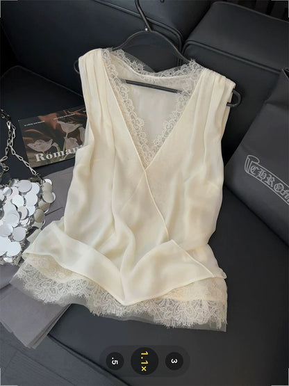 French-style lace-trimmed vest with mesh crossover design, a gentle V-neck sleeveless top perfect for summer 2025.