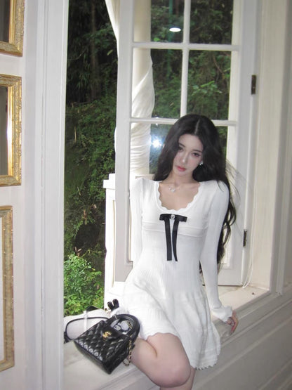 Barb Chill's elegant Miu-style white knit dress with a Korean-style bow and long sleeves.