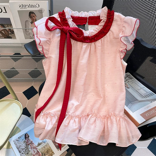 This year's beautiful tie-neck polka dot shirt, a new summer style for men and women, featuring a sweet and stylish pink color and flutter sleeves.