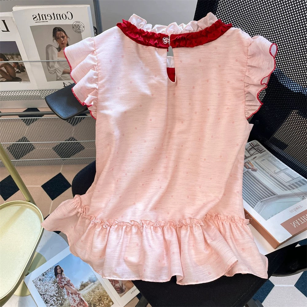 This year's beautiful tie-neck polka dot shirt, a new summer style for men and women, featuring a sweet and stylish pink color and flutter sleeves.