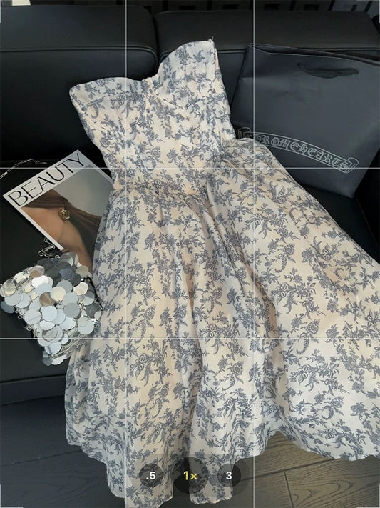 Blue and white porcelain floral print strapless dress, elegant and sophisticated, new 2025 style, fitted waist and full skirt.