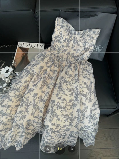 Blue and white porcelain floral print strapless dress, elegant and sophisticated, new 2025 style, fitted waist and full skirt.