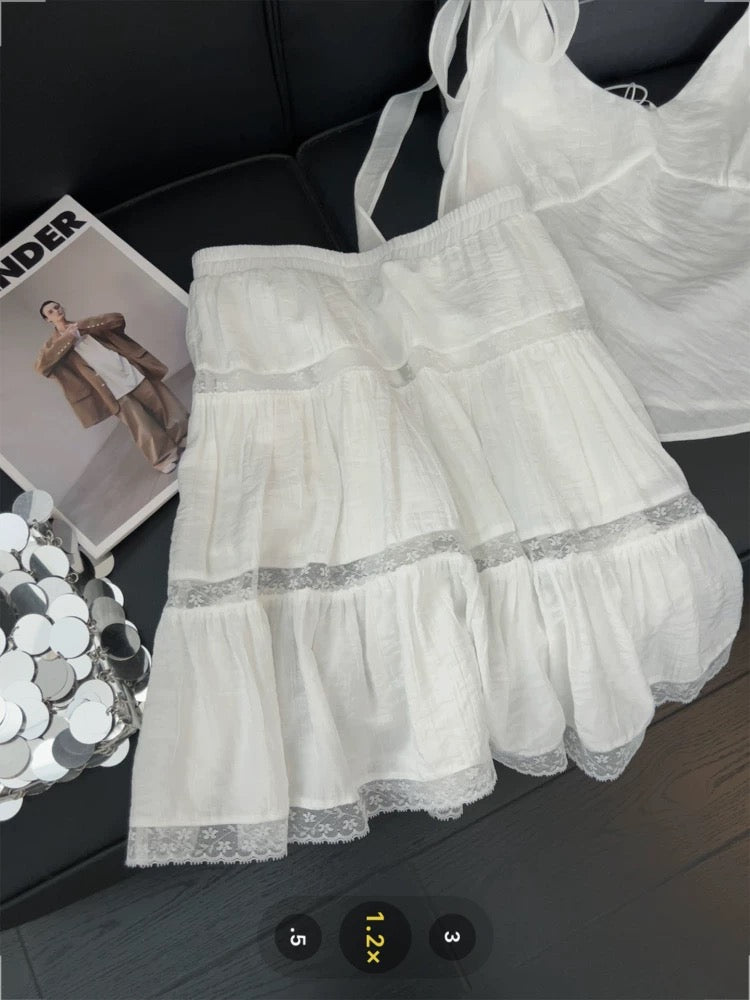 Korean style sweet and spicy two-piece suit set: bow tie V-neck camisole top with lace cutout skirt.