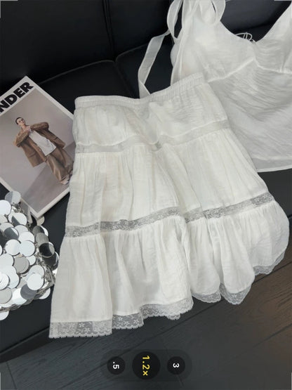 Korean style sweet and spicy two-piece suit set: bow tie V-neck camisole top with lace cutout skirt.