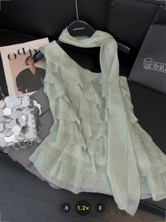 Asymmetrical ruffled one-shoulder camisole with ribbon halter neck design, sweet and spicy style, layered tiered off-shoulder top.