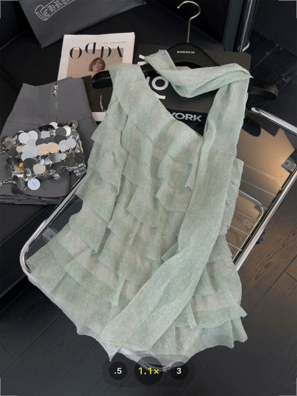 Asymmetrical ruffled one-shoulder camisole with ribbon halter neck design, sweet and spicy style, layered tiered off-shoulder top.