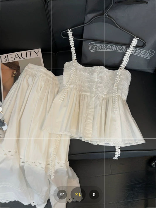 White lace two-piece suit for women, featuring a sweet and spicy style, a unique design, a halter top, and a hollowed-out A-line skirt.