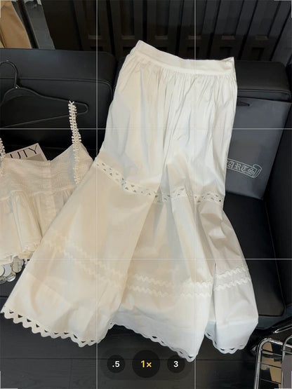 White lace two-piece suit for women, featuring a sweet and spicy style, a unique design, a halter top, and a hollowed-out A-line skirt.