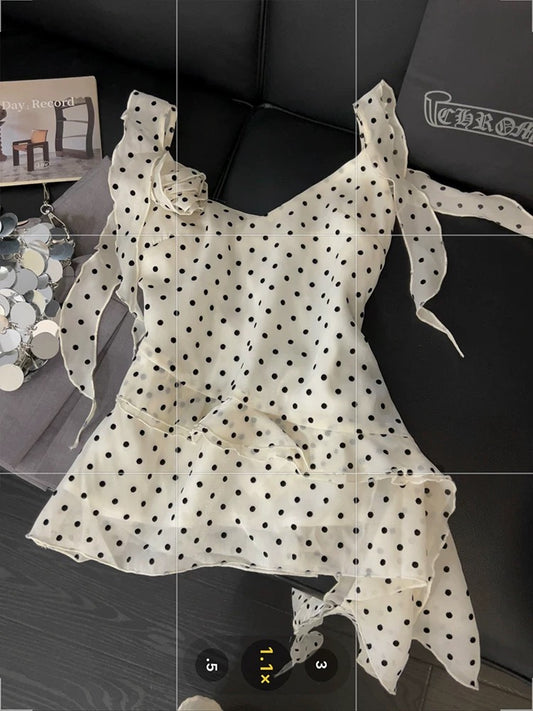 Ruffled polka dot camisole for women, asymmetrical ribbon design, unique summer style, three-dimensional floral pattern, versatile top.