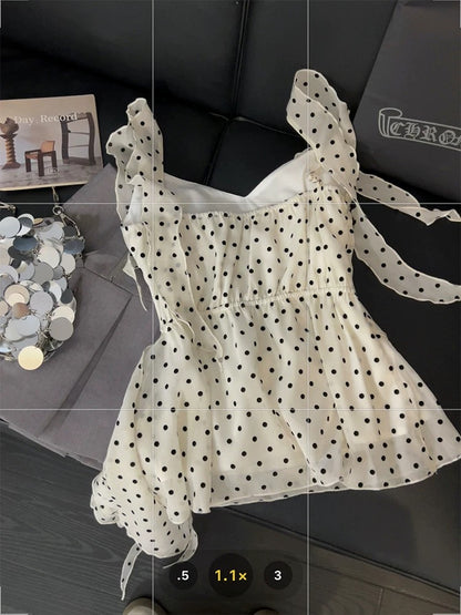 Ruffled polka dot camisole for women, asymmetrical ribbon design, unique summer style, three-dimensional floral pattern, versatile top.
