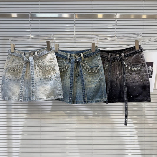Internet celebrity same style 2025 summer new street hot girl rhinestone beaded strap heavy denim short skirt A-line skirt female