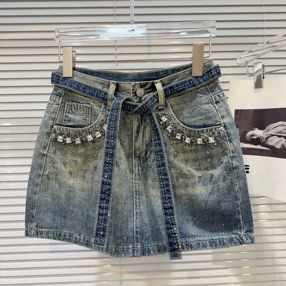 Internet celebrity same style 2025 summer new street hot girl rhinestone beaded strap heavy denim short skirt A-line skirt female
