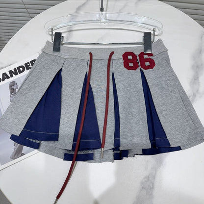 Internet celebrity style 2025 summer new niche characteristics letter patch contrast color drawstring pleated skirt short skirt A-line skirt