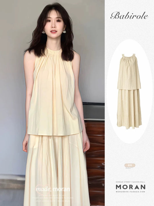 Cream yellow halterneck top, high-waisted skirt, two-piece set for women, French pleated temperament suit, summer gentleness