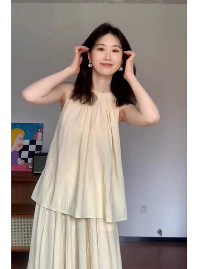 Cream yellow halterneck top, high-waisted skirt, two-piece set for women, French pleated temperament suit, summer gentleness