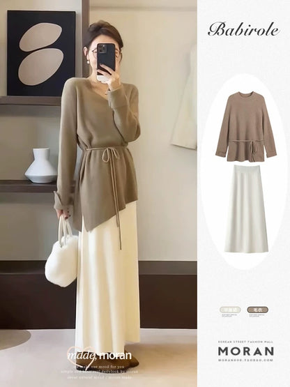 Salt-style mature and gentle two-piece set: long-sleeved knit top and midi skirt, exuding a sophisticated and elegant spring and autumn vibe.