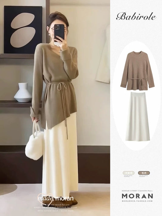 Salt-style mature and gentle two-piece set: long-sleeved knit top and midi skirt, exuding a sophisticated and elegant spring and autumn vibe.