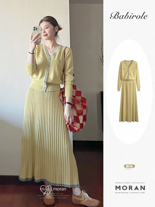 French-style yellow knitted cardigan, skirt, and dress two-piece set for women, a sophisticated and youthful autumn outfit.