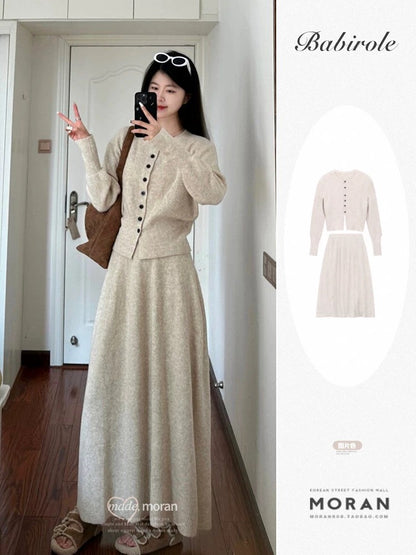 A unique and stylish Korean-inspired outfit: a complete OOTD (Outfit of the Day) look featuring a sweater, cardigan, and knitted maxi skirt – two pieces perfect for autumn and winter.