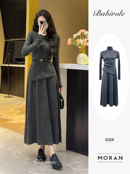 A stylish 2025 new winter outfit: a sophisticated two-piece set featuring a knitted top and a long skirt.