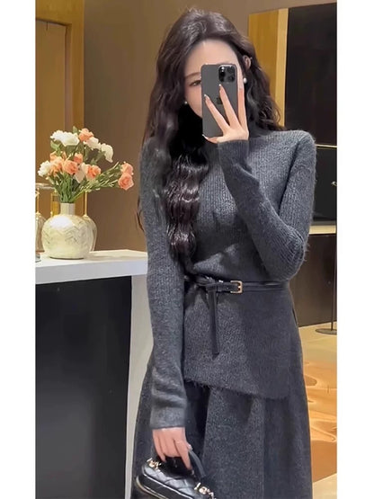 A stylish 2025 new winter outfit: a sophisticated two-piece set featuring a knitted top and a long skirt.