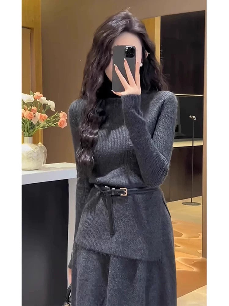 A stylish 2025 new winter outfit: a sophisticated two-piece set featuring a knitted top and a long skirt.