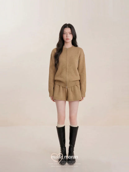 This is a super stylish Korean-style sweater and skirt set that's youthful, chic, and effortlessly luxurious.