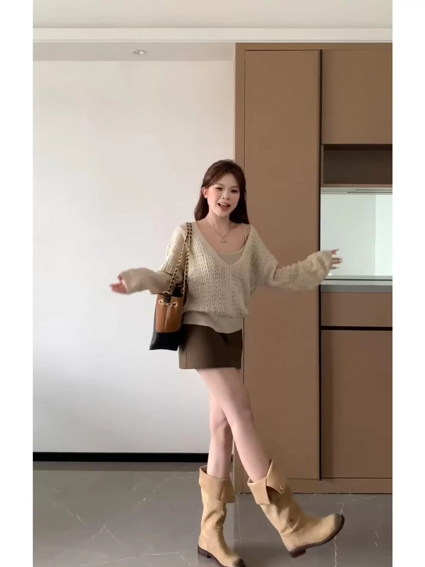 This two-piece set is super cute for autumn! It's a pretty Korean-style knitted cardigan and skirt set perfect for petite women.