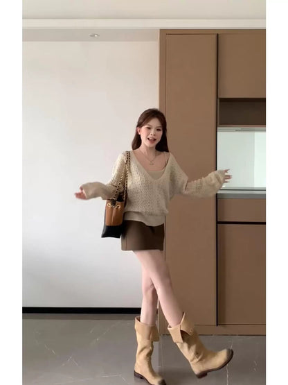 This two-piece set is super cute for autumn! It's a pretty Korean-style knitted cardigan and skirt set perfect for petite women.