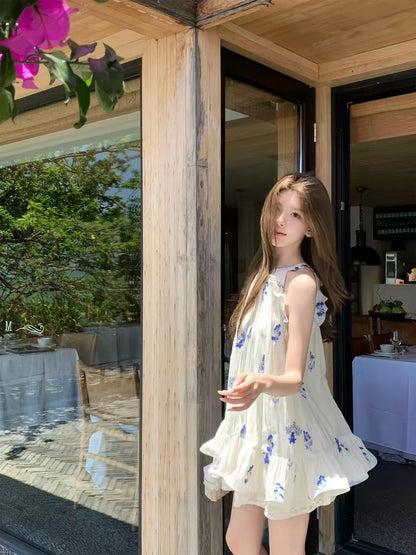 Q-Girl's Collection: Sleeveless A-line dress featuring a blue-and-white ink wash floral print, delicate lace, and a soft blue palette—an elegant summer choice for petite women.