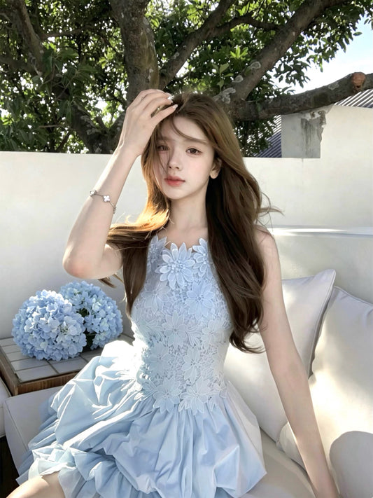 Q-Girl's "Floating Floral & Indigo" Collection: Exquisite, unique French-style princess dress featuring intricate craftsmanship, a blue sleeveless tulip-skirt silhouette, and delicate straps.