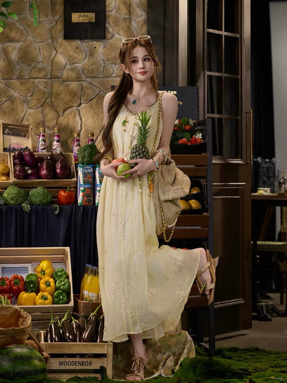 TUNTUN Spring/Summer "Butterfly Dream" Collection: A breezy, soft-style V-neck camisole dress featuring exquisite floral embroidery.