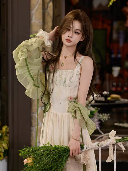 TUNTUN Spring/Summer "Green Vine Sprite" French-style camisole dress featuring a botanical print and a pastoral, forest-inspired aesthetic.