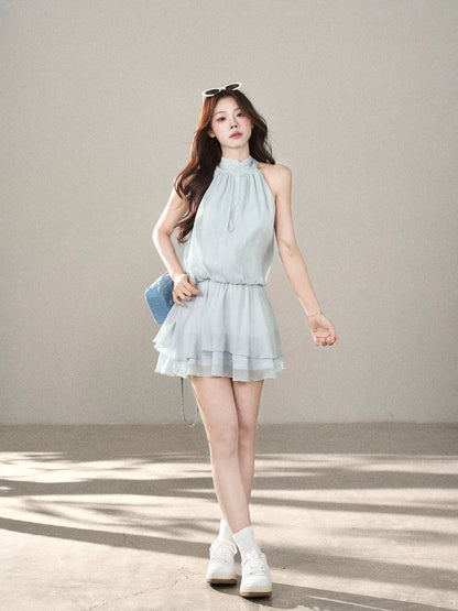 A sleeveless halter-neck dress with a wild berry design, a super cute new summer 2026 style, featuring a fitted waist and a fairy-like silhouette.