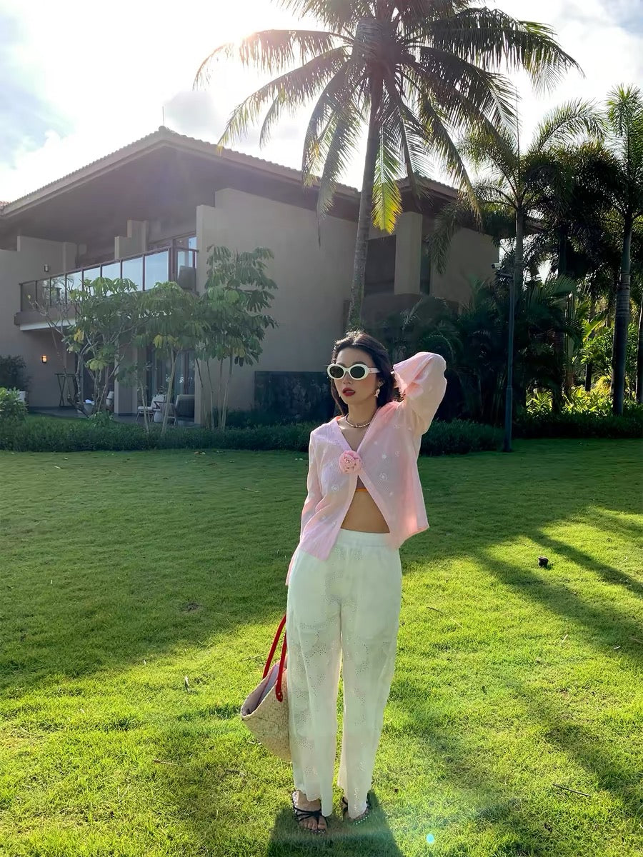 Distinctive and refined: a chic, Korean-style blouse featuring pink embroidery and a V-neck—a new long-sleeved top for 2026.