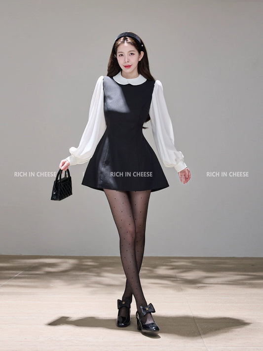 Shu Hulei, a college heiress, wears a French-style A-line vest dress with a overlapping collar and color-blocked design.