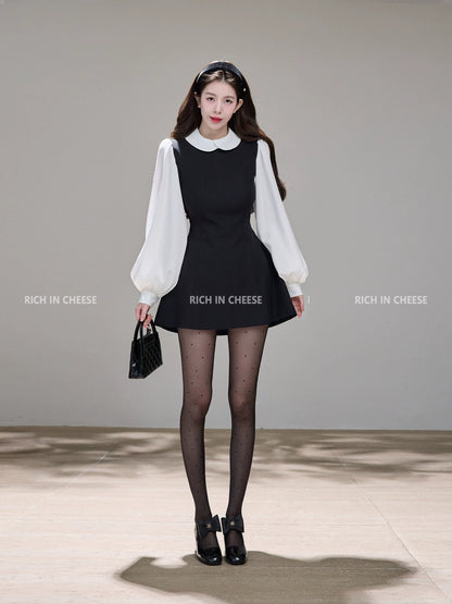 Shu Hulei, a college heiress, wears a French-style A-line vest dress with a overlapping collar and color-blocked design.