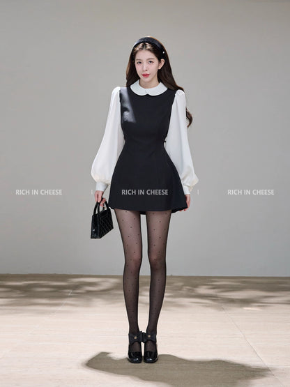 Shu Hulei, a college heiress, wears a French-style A-line vest dress with a overlapping collar and color-blocked design.