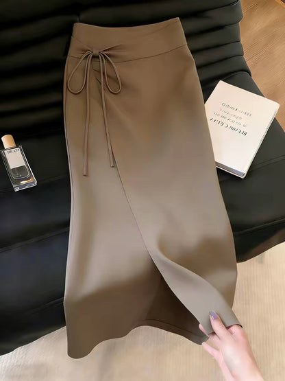 Women's brown skirt with a stylish slit design—a unique, chic, and sophisticated piece from the Summer 2026 collection that stands out from the crowd.