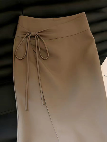 Women's brown skirt with a stylish slit design—a unique, chic, and sophisticated piece from the Summer 2026 collection that stands out from the crowd.
