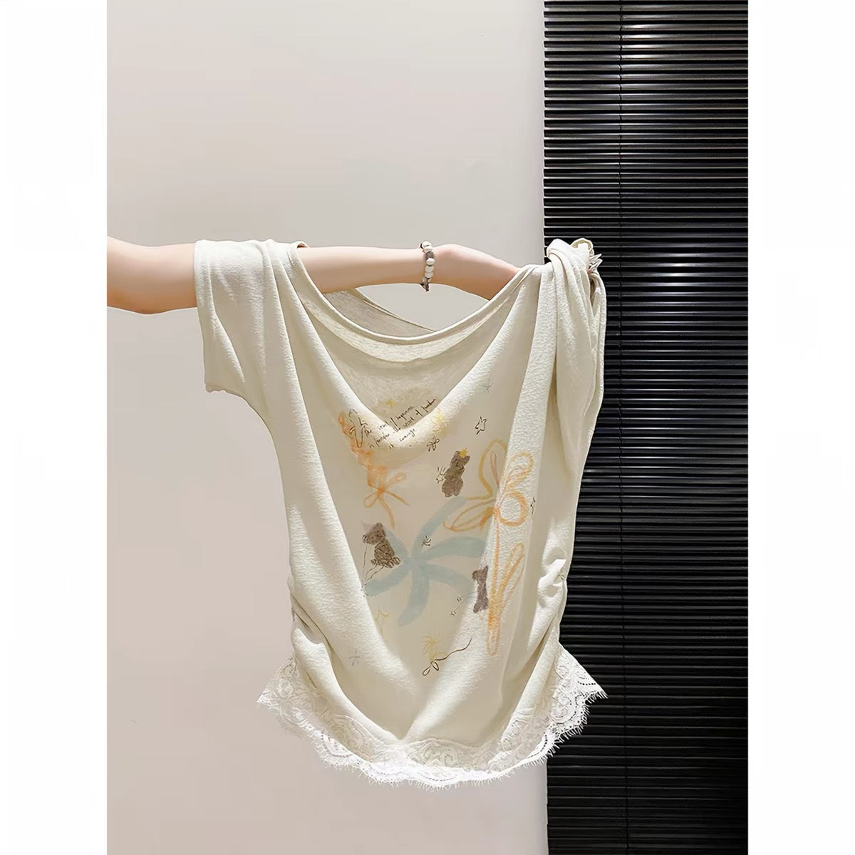 Korean-style sweet and spicy printed asymmetric-neck short-sleeve T-shirt for women; new summer arrival featuring a lace hem, waist-cinching fit, and a stylish, flattering look.