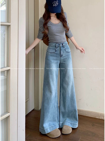 High-waisted, loose-fitting wide-leg jeans, versatile denim for women, spring retro blue floor-length straight leg trousers with a slight flare.