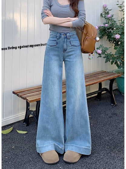 High-waisted, loose-fitting wide-leg jeans, versatile denim for women, spring retro blue floor-length straight leg trousers with a slight flare.