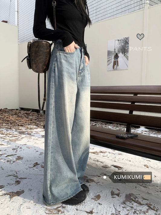 Retro-style light blue washed denim wide-leg jeans for women, high-waisted, loose-fitting, straight-leg, floor-length trousers, trendy.