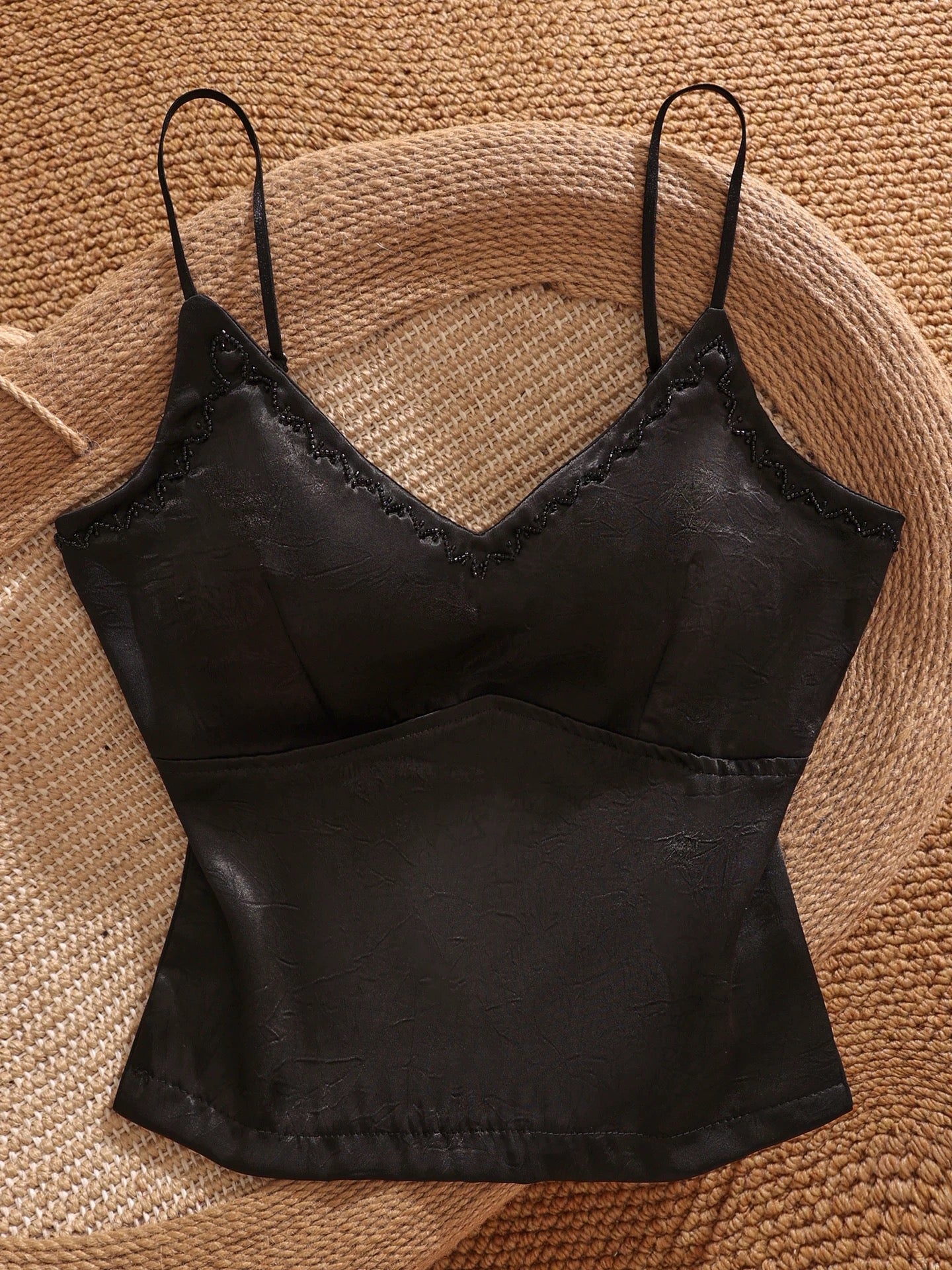 Black satin camisole with padded bra, versatile, stylish, sexy, slimming, and flattering short top for women.