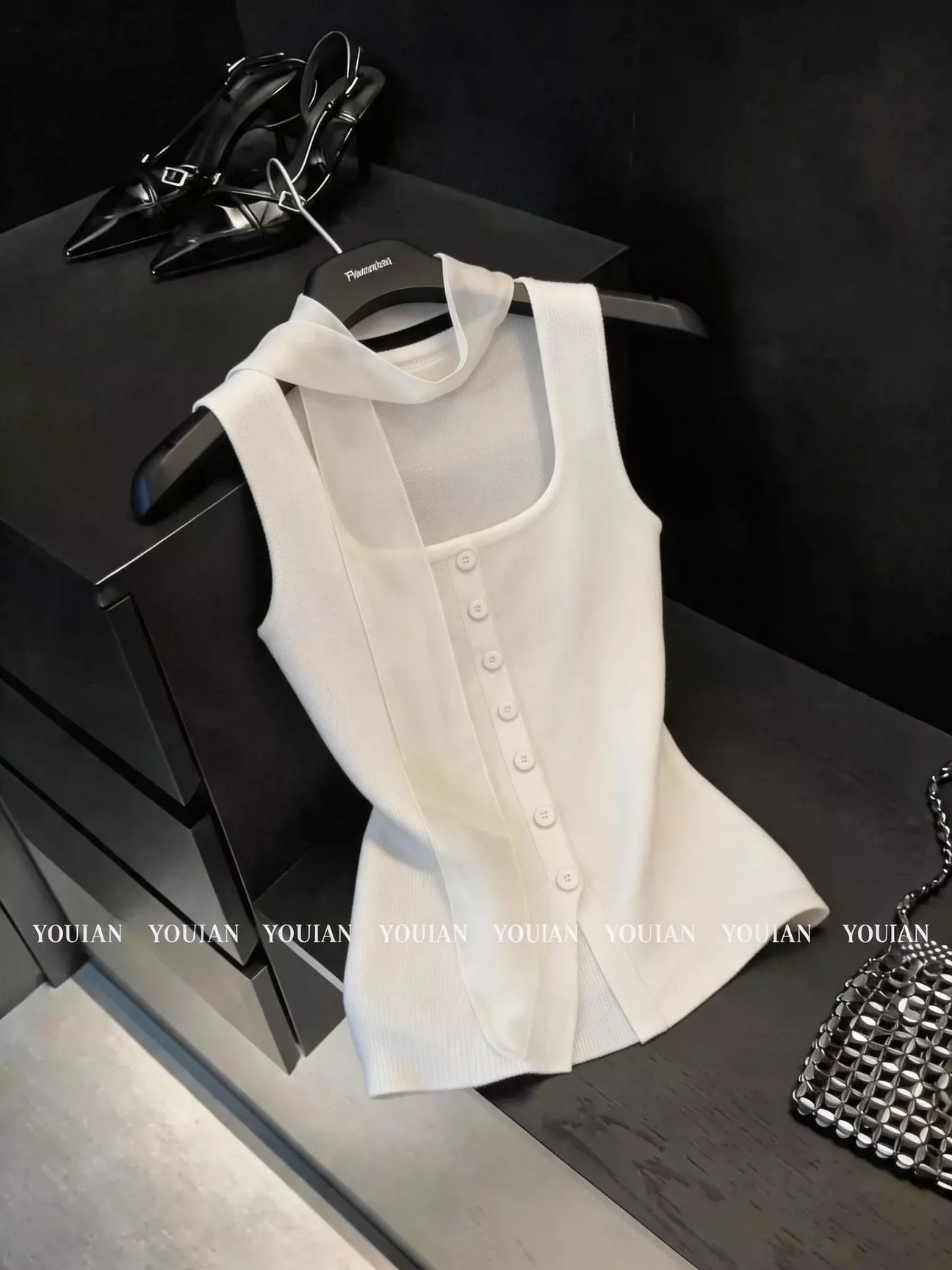 Chic French-style ice-silk knit camisole featuring a square neck and elegant ribbon halter straps—a stylish, sleeveless top perfect for summer wear.